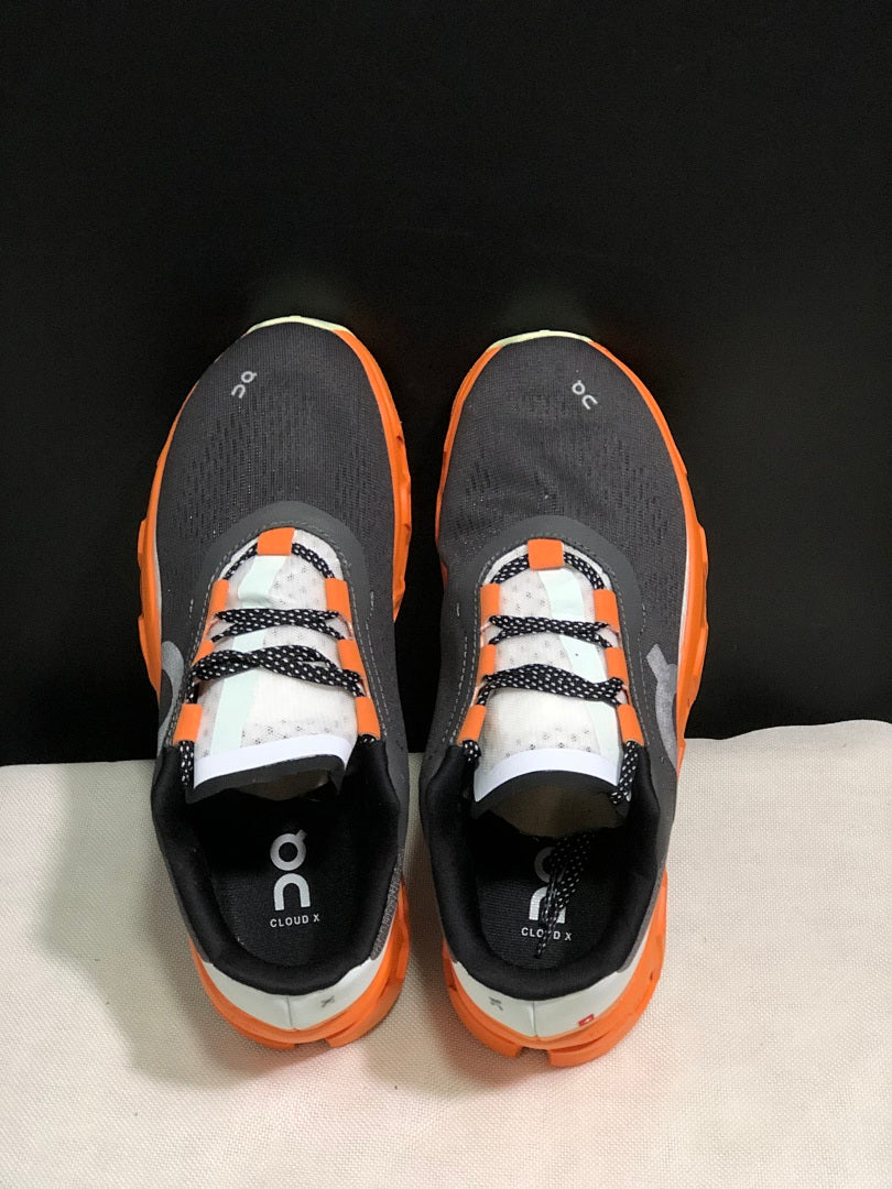 On Cloudmonster Running Shoes in Black Orange - product image from the listing.