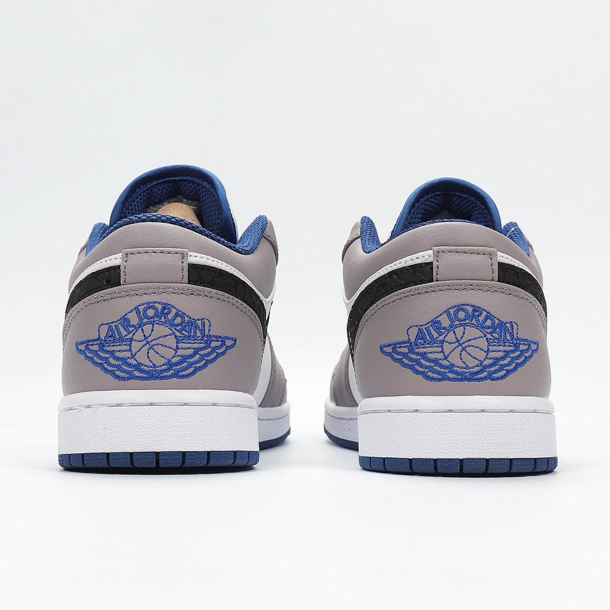 Jordan 1 Low Sneakers in White Grey Blue 553558-103 - product image from the listing.