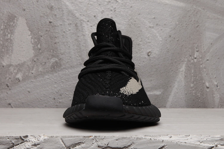 Yeezy 350 V2 Sneakers in Black and Cream - product image from the listing.
