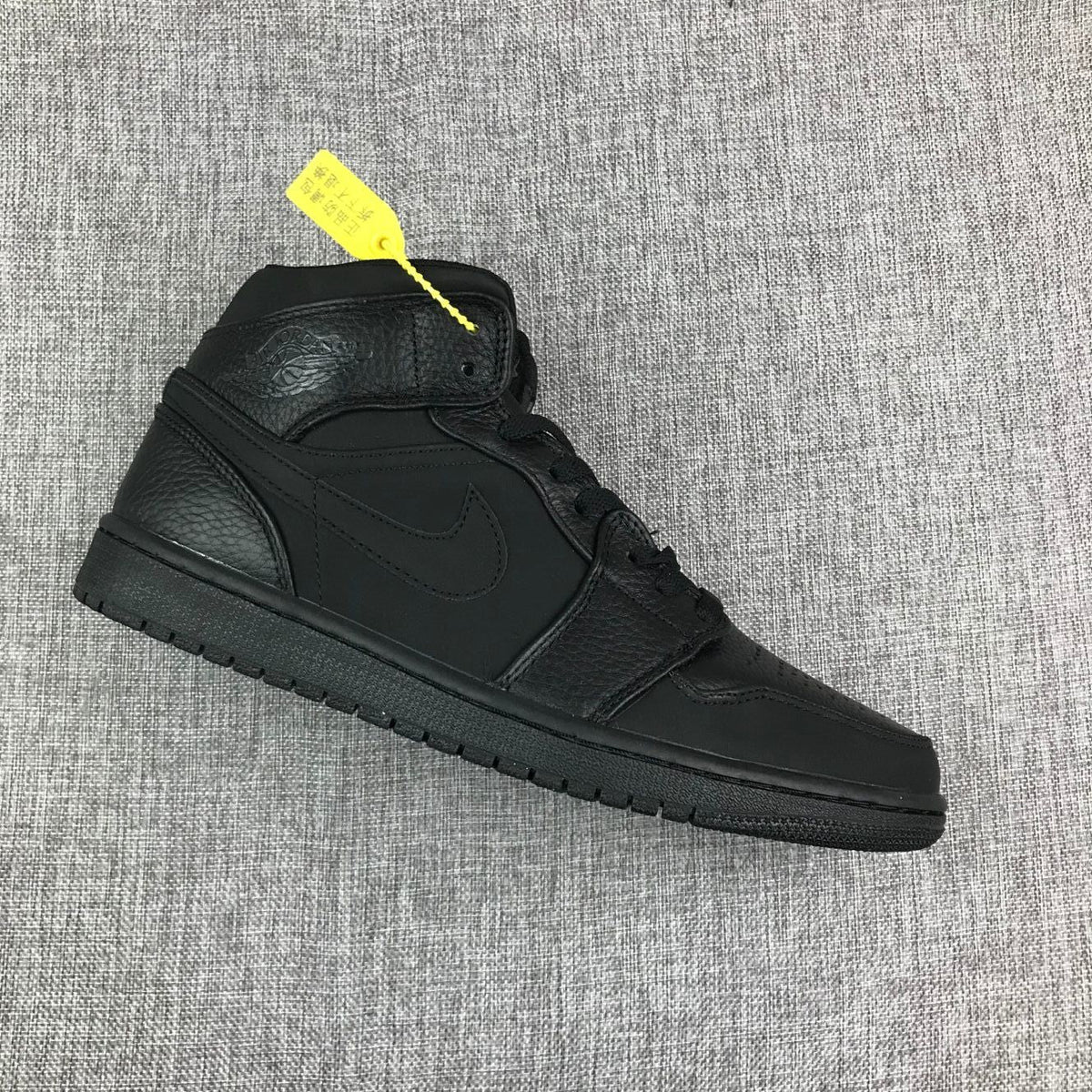 Air Jordan 1 Mid Sneakers, in Black - product image from the listing.