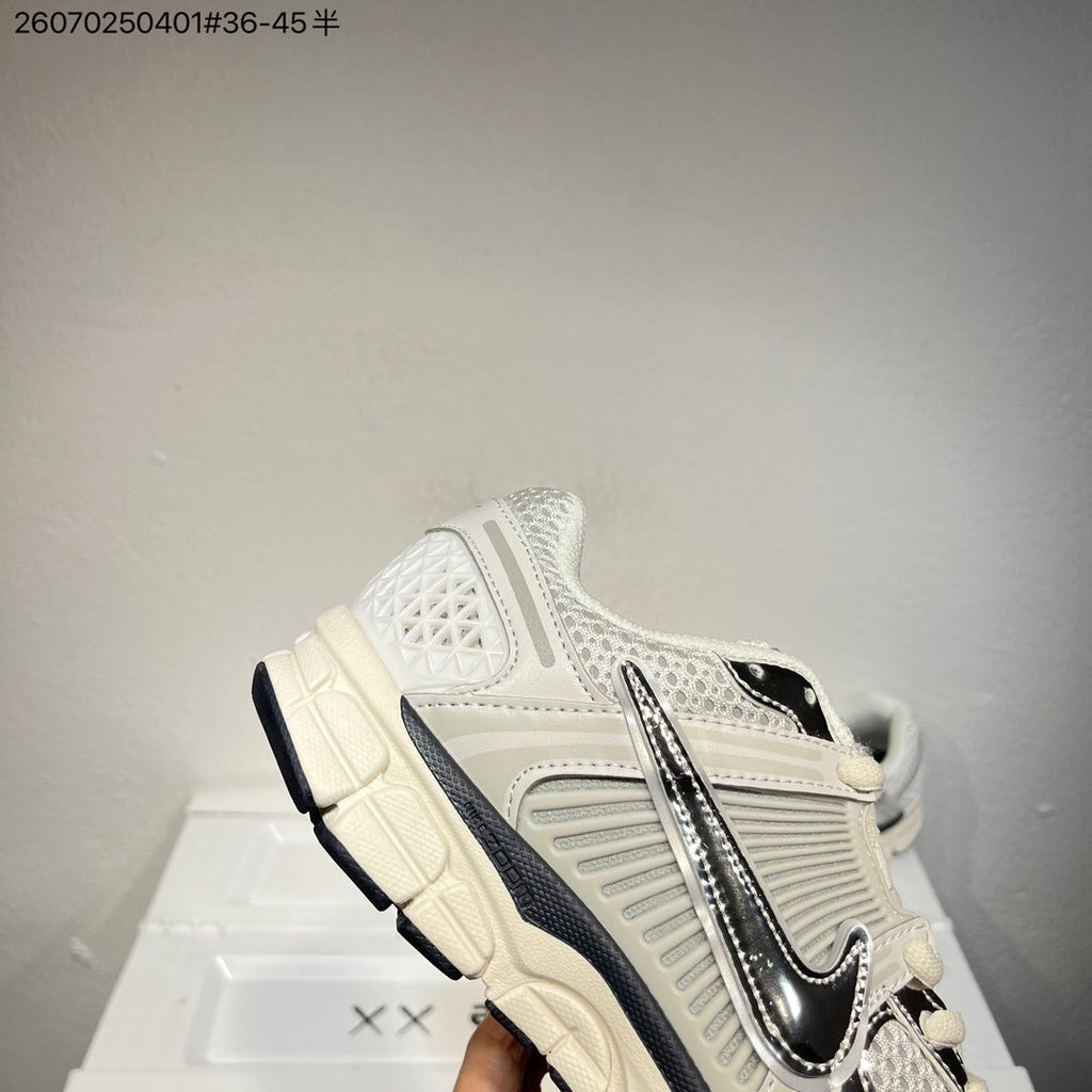 Nike Air Zoom Vomero 5 Sneakers, in White and Black - product image from the listing.
