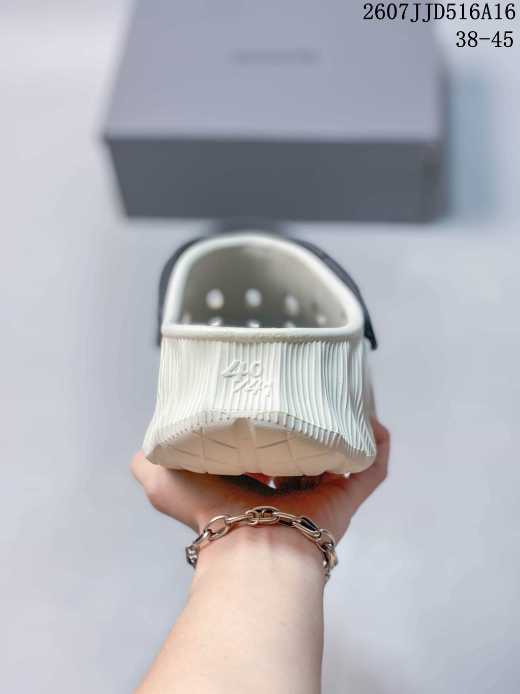 Balenciaga 2607JJD516A16 Clog Sandals Off-White in Navy - product image from the listing.