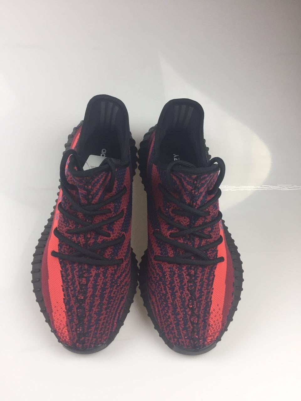 Adidas Yeezy Boost 350 V2 Sneakers in Black and Burgundy - product image from the listing.