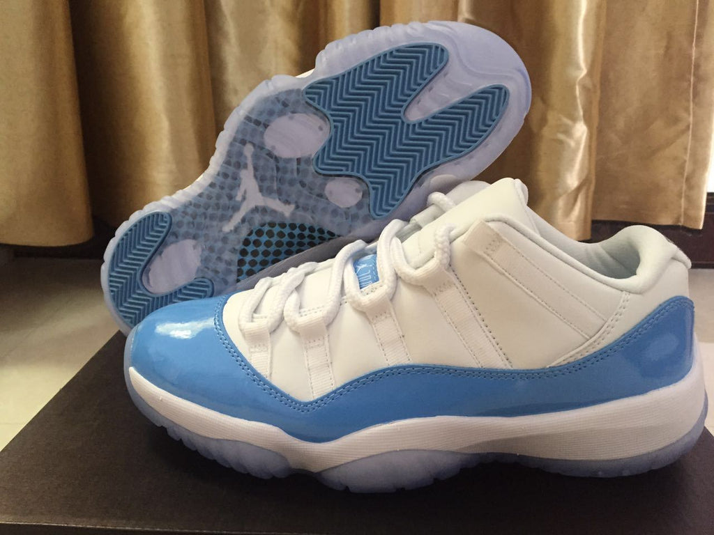 White and University Blue Jordan 11 Low Sneakers - product image from the listing.