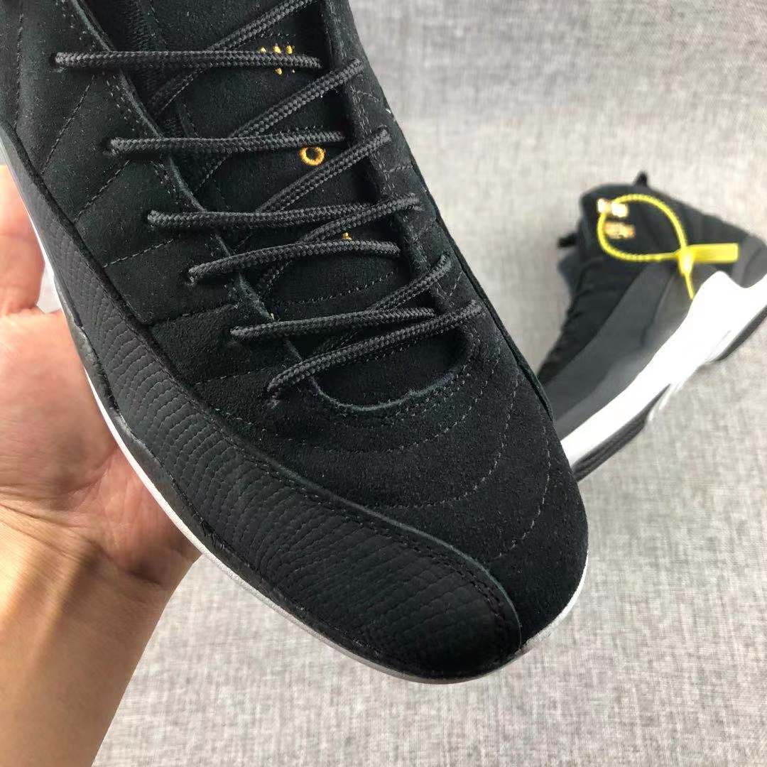 Air Jordan 12 Black Gold Sneakers 130690-017 - product image from the listing.