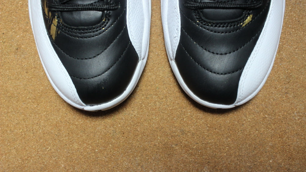 Air Jordan 12 Wings Black White Gold Sneakers 848692-033 - product image from the listing.