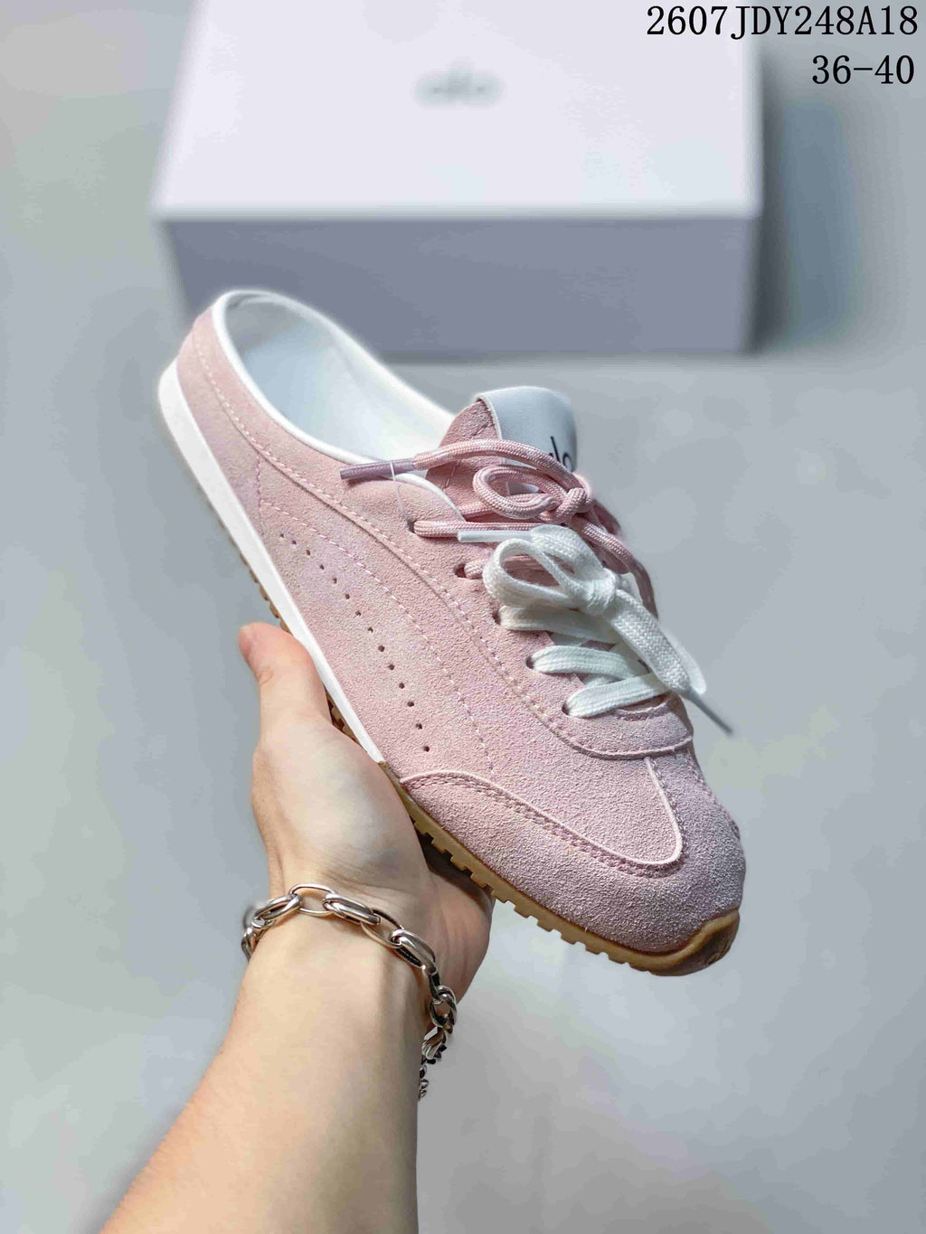 alo Sunset Mule Sneakers in Pink, in Navy and Cream - product image from the listing.