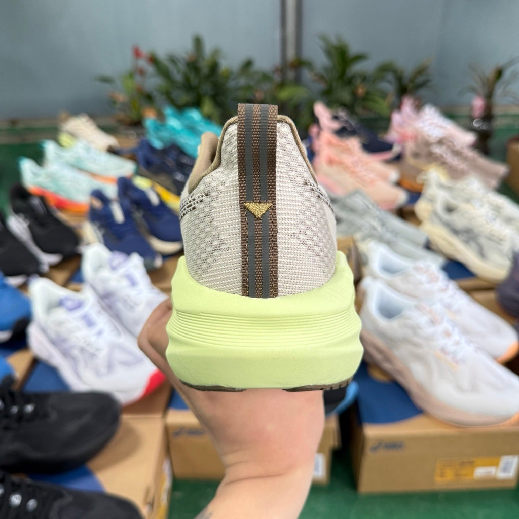ASICS NOVABLAST 5 LE Running Shoes in Beige Grey Brown - product image from the listing.