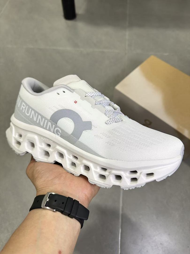 On Running Running Sneakers in White and Gray - product image from the listing.