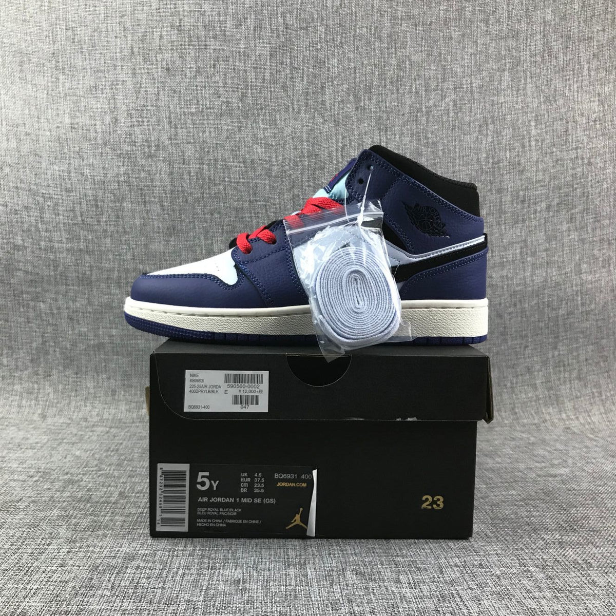 Air Jordan 1 Mid White, Sneakers in Black and Purple - product image from the listing.