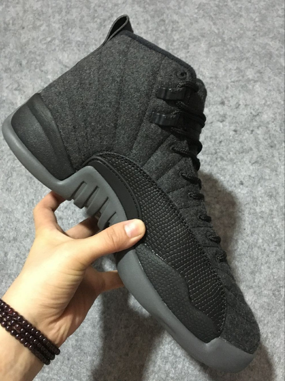 Black and Grey Air Jordan 12 High-Top Sneakers - product image from the listing.
