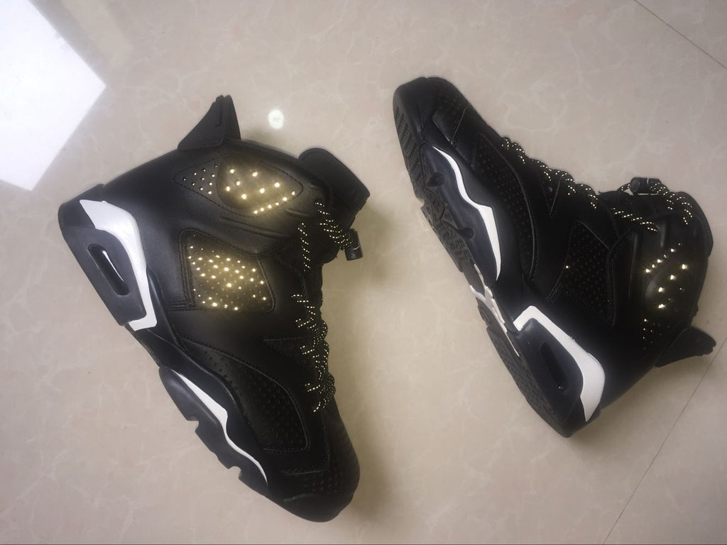 Jordan 6 Retro Black Cat High-Top Sneakers in Black and White - product image from the listing.
