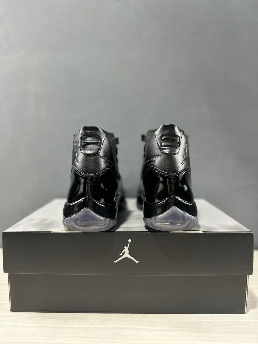 Comme des Garçons × Jordan Air Jordan 11 Sneakers in Black - product image from the listing.