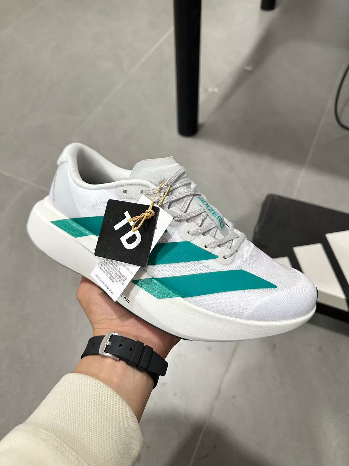 adidas Lightstrike Pro Running Shoes in White and Teal JR4451 - product image from the listing.