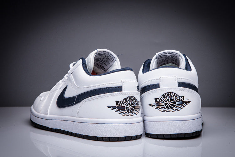 Air Jordan 1 Low White and Black Sneakers - product image from the listing.