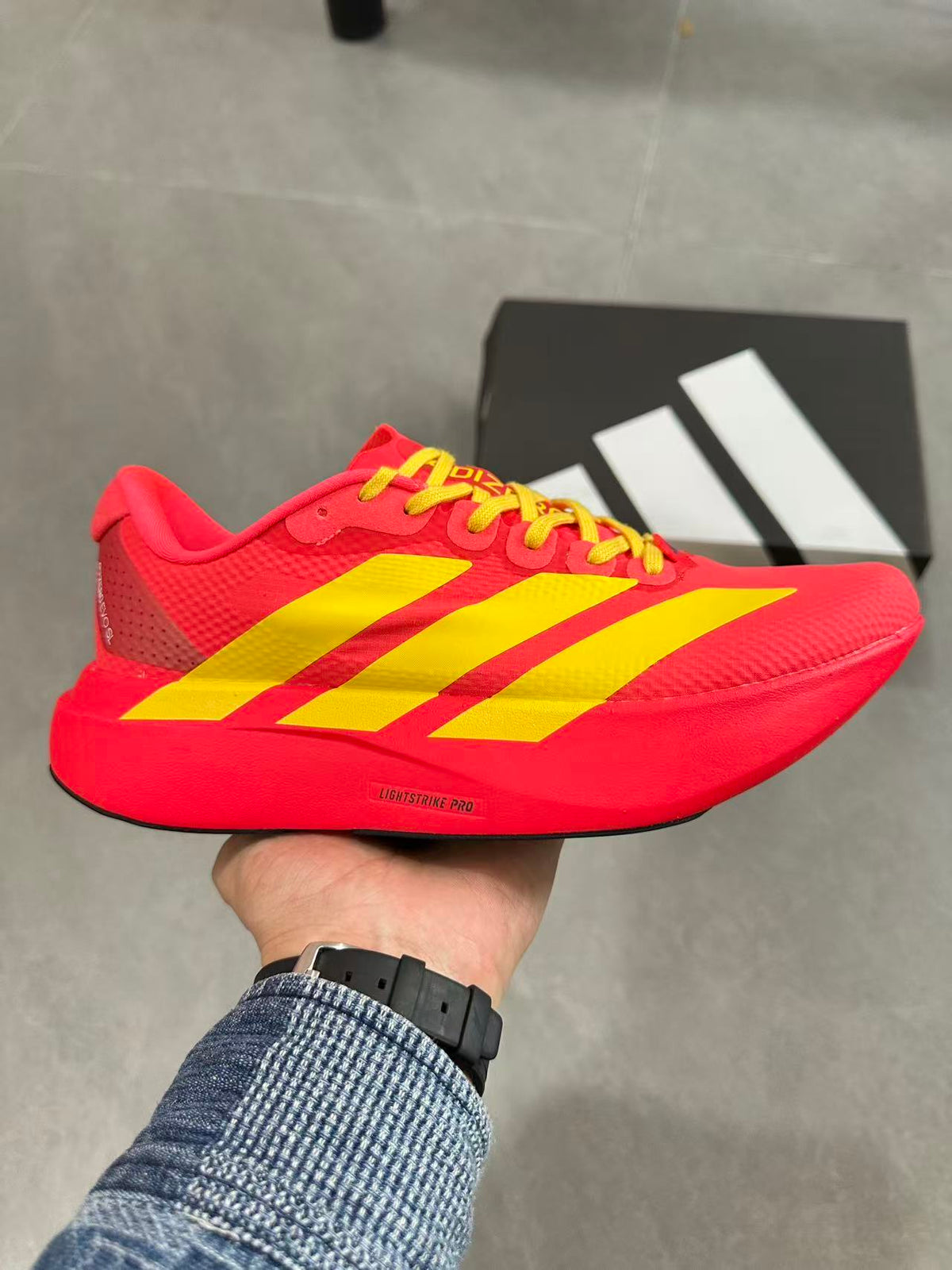 Adidas Lightstrike Pro Running Shoes in Red Yellow JQ4442 - product image from the listing.