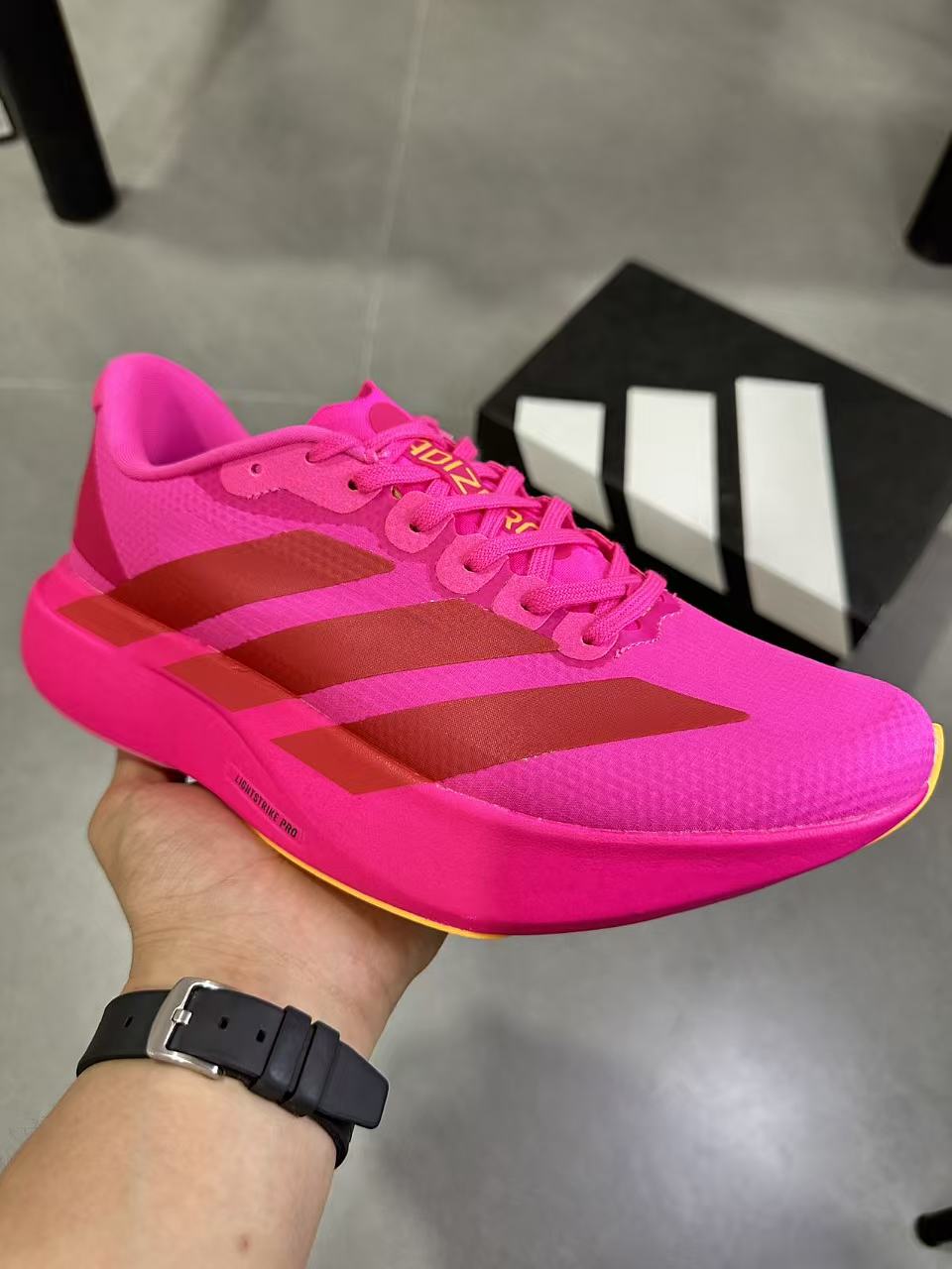 Magenta adidas Lightstrike Pro Running Shoes KI6902 - product image from the listing.