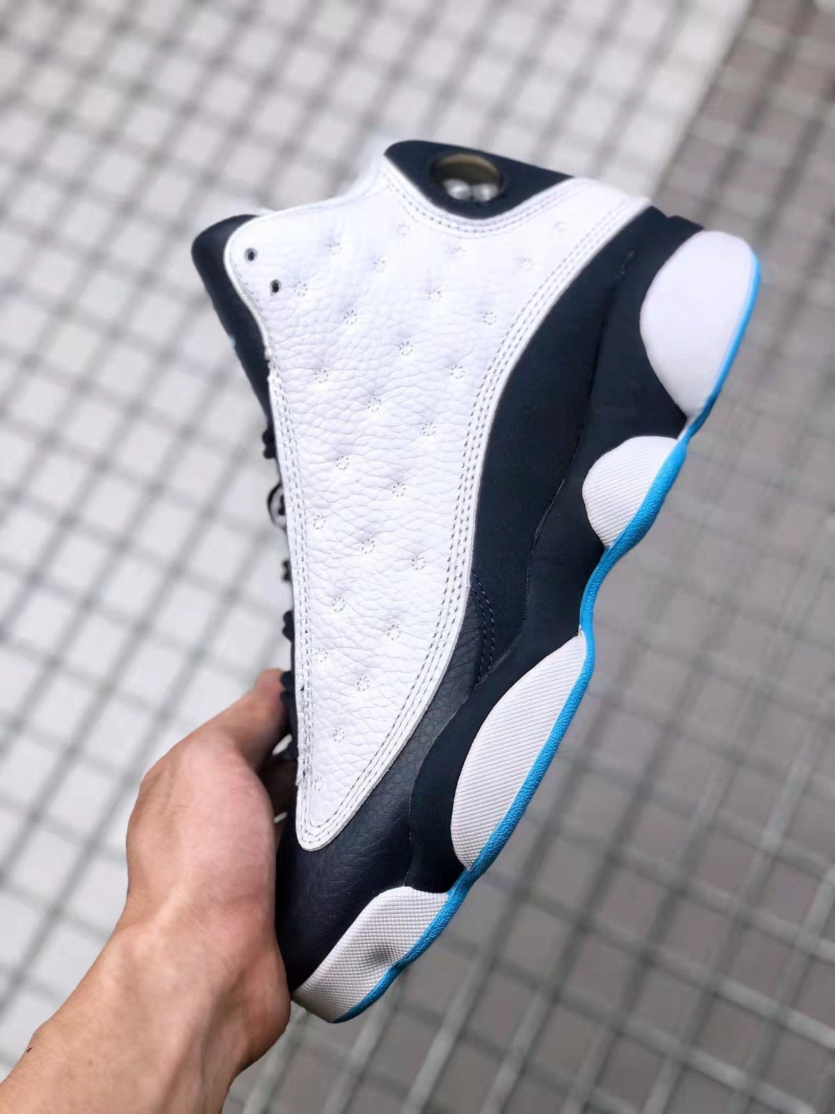 Air Jordan 13 Obsidian Sneakers 414571-144 - product image from the listing.