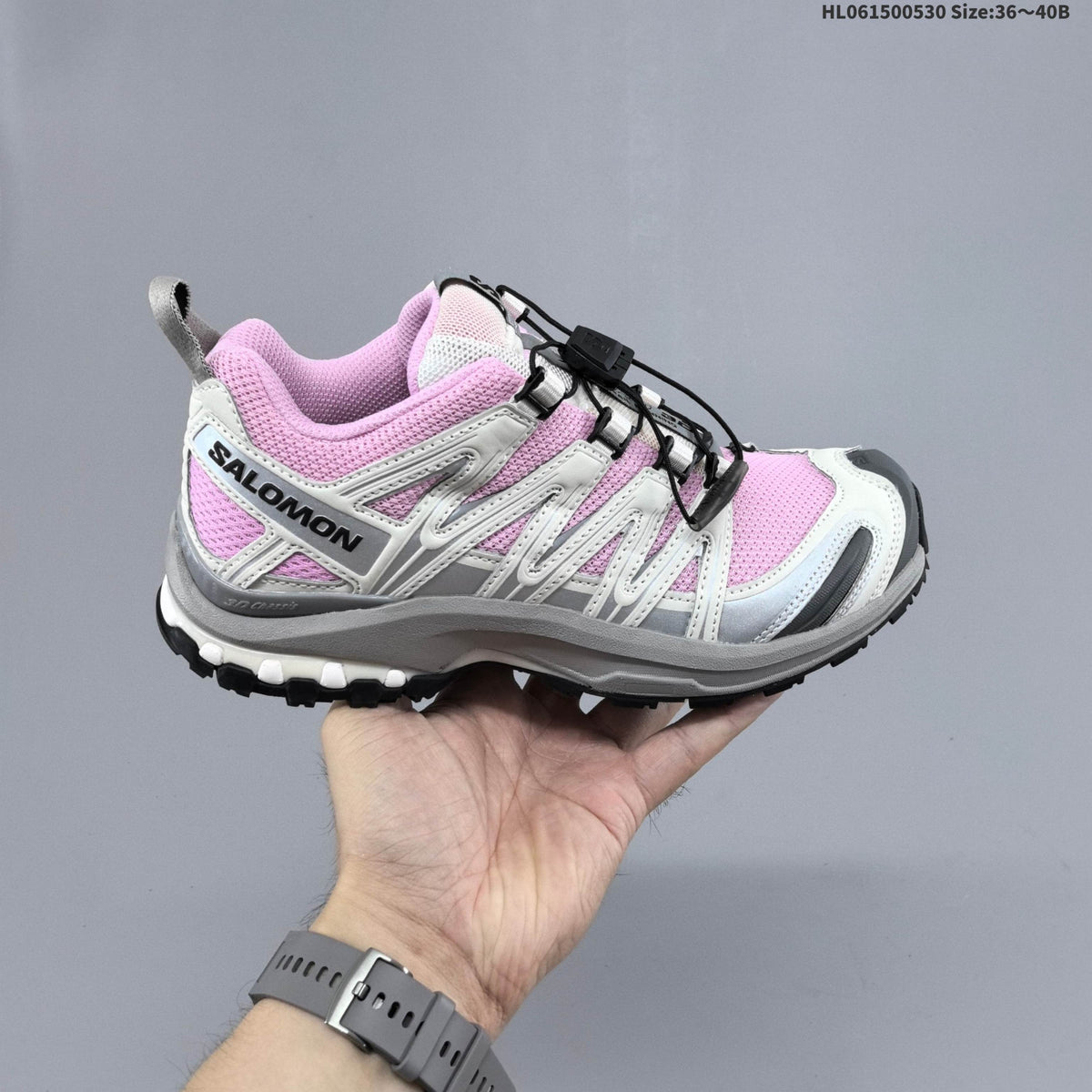 Pink and White Salomon XA PRO 3D Trail Running Shoes - product image from the listing.