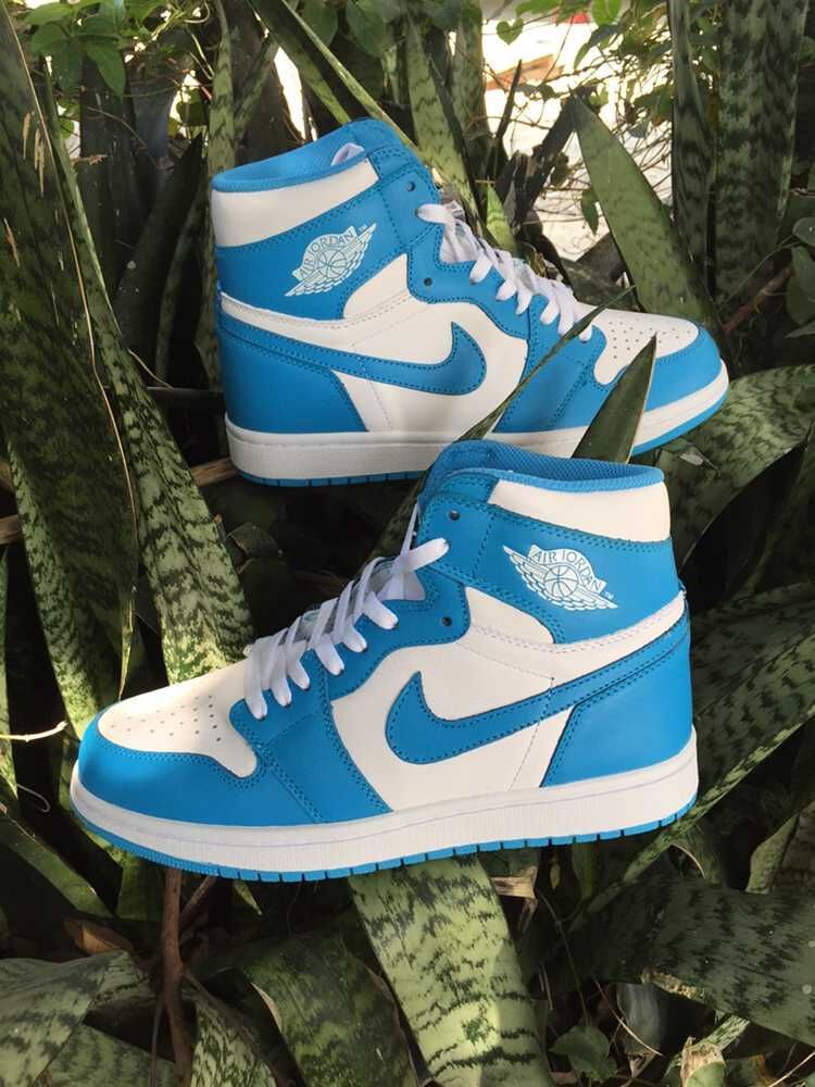 Blue and White Air Jordan 1 High Sneakers - product image from the listing.