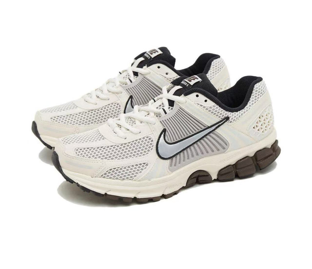 Metallic Silver and White Nike Vomero 5 Sneakers - product image from the listing.