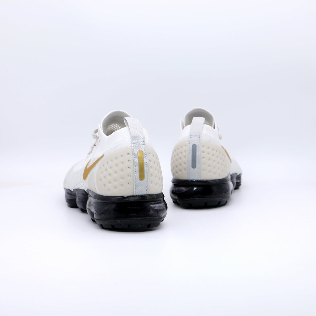 Nike Air VaporMax Flyknit Sneakers in White Gold Black 942842-010 - product image from the listing.