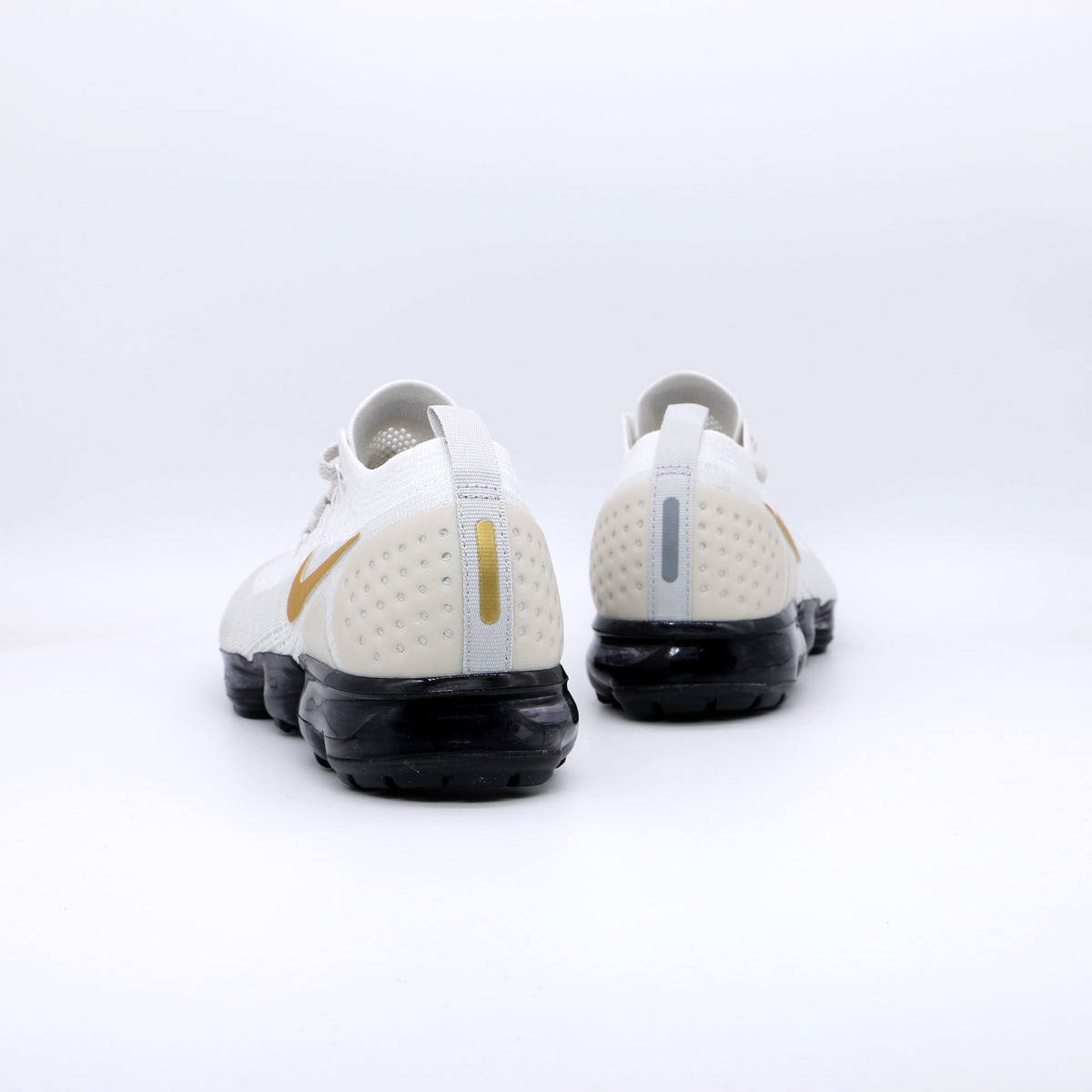 Nike Air VaporMax Flyknit Sneakers in White Gold Black 942842-010 - product image from the listing.