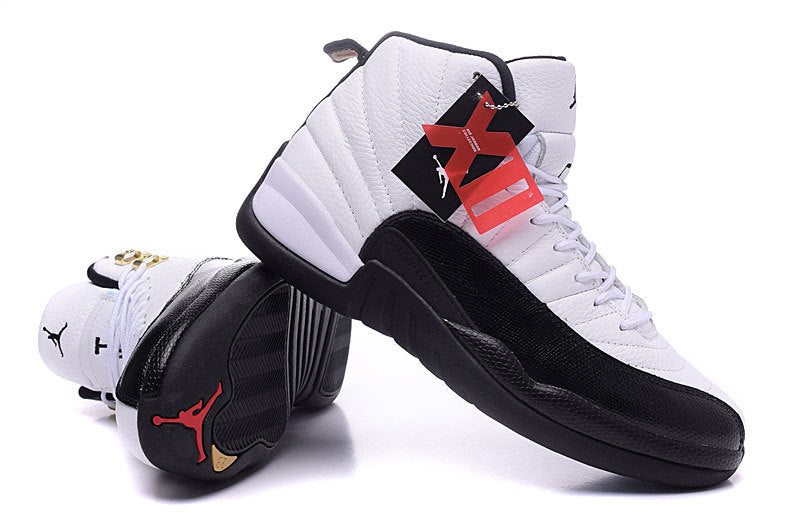Air Jordan 12 Retro White and Black High-Top Sneakers - product image from the listing.