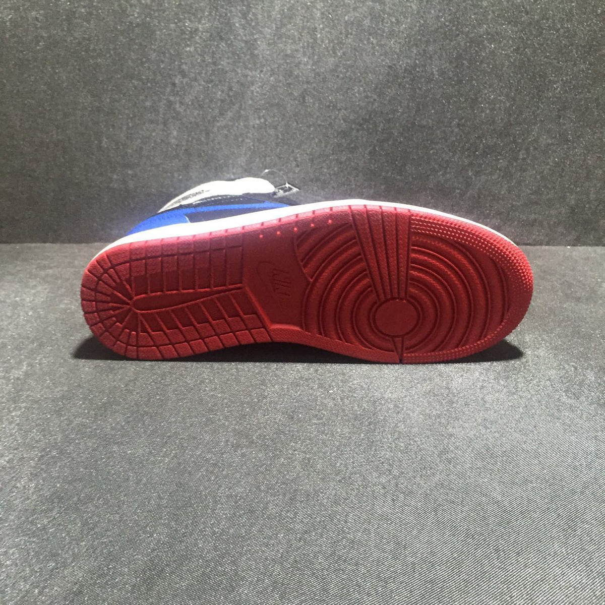 Jordan 1 High Three-Color Sneaker in Black, in Blue and Red - product image from the listing.