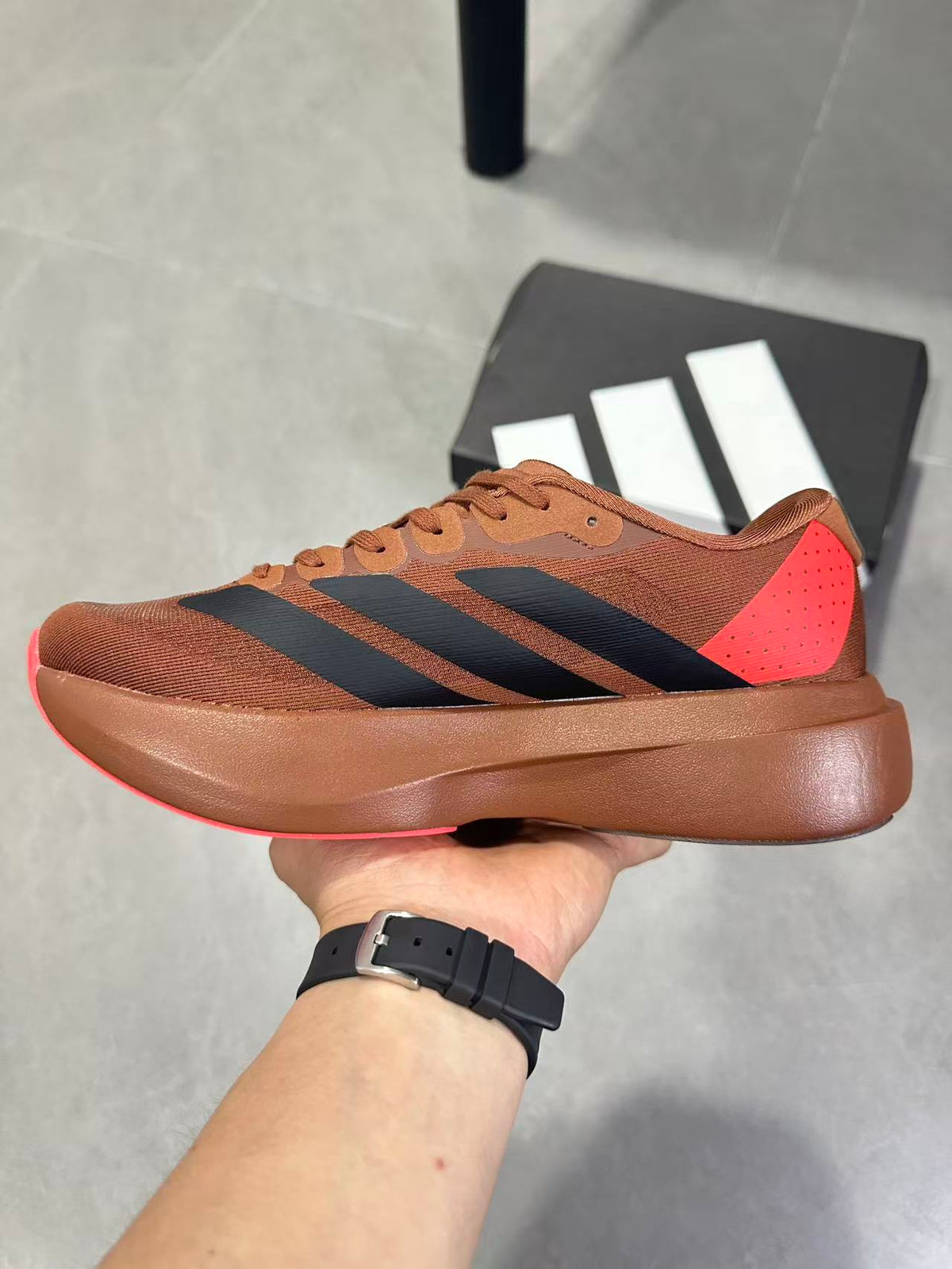 Adizero Lightstrike Pro Running Shoes, in Brown and Black KJ8809 - product image from the listing.