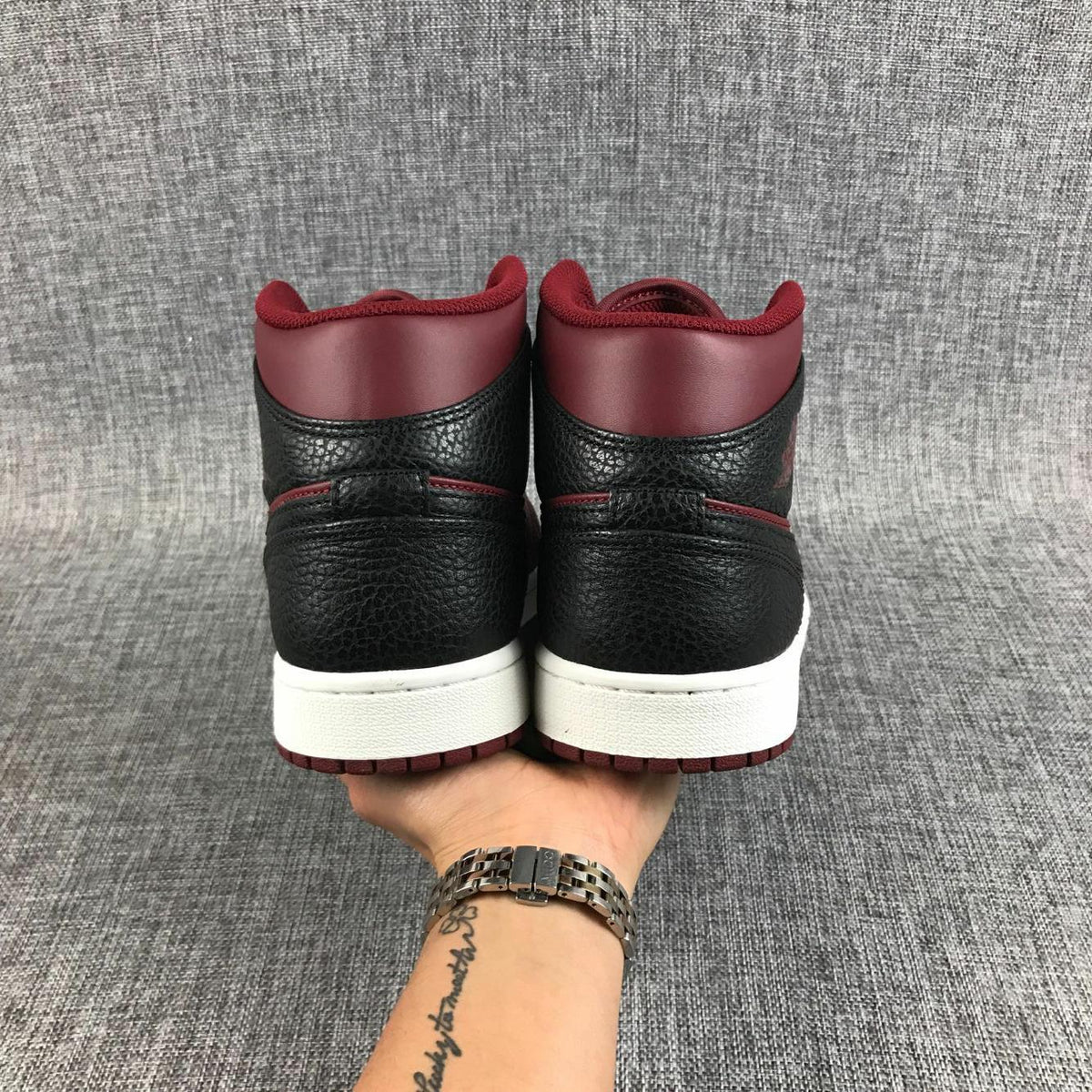 Air Jordan 1 Mid Sneakers in Black and Burgundy 554724-601 - product image from the listing.
