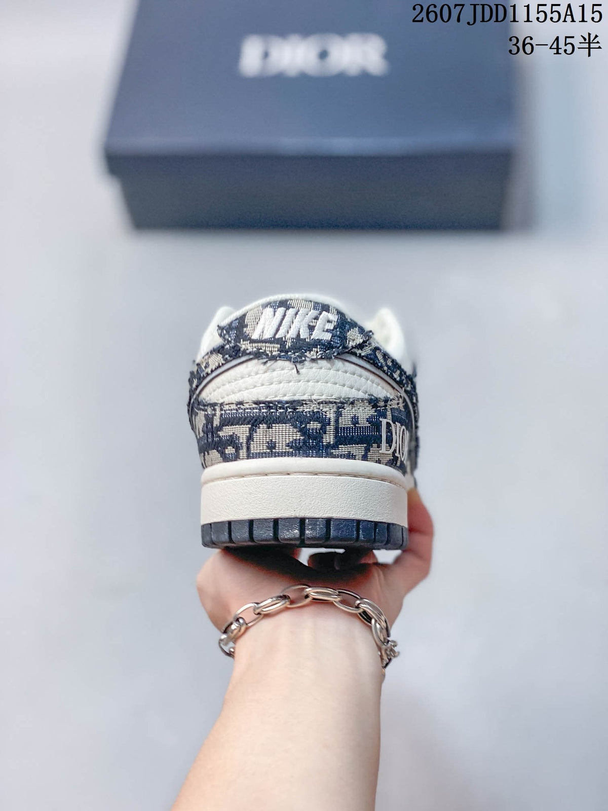 Nike SB Dunk Low White Navy Dior Pattern Trainers - product image from the listing.