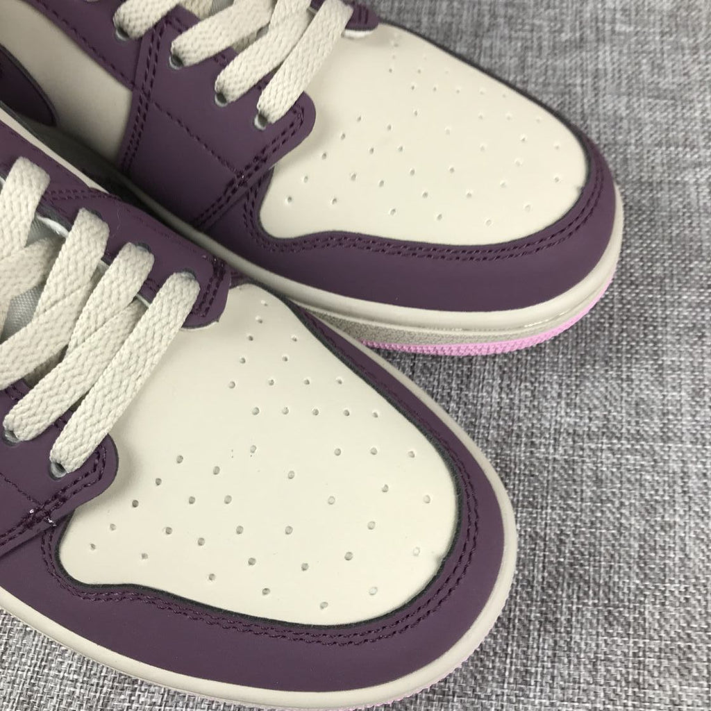 Air Jordan 1 Mid Sneakers in Pink Purple 555112-500 - product image from the listing.