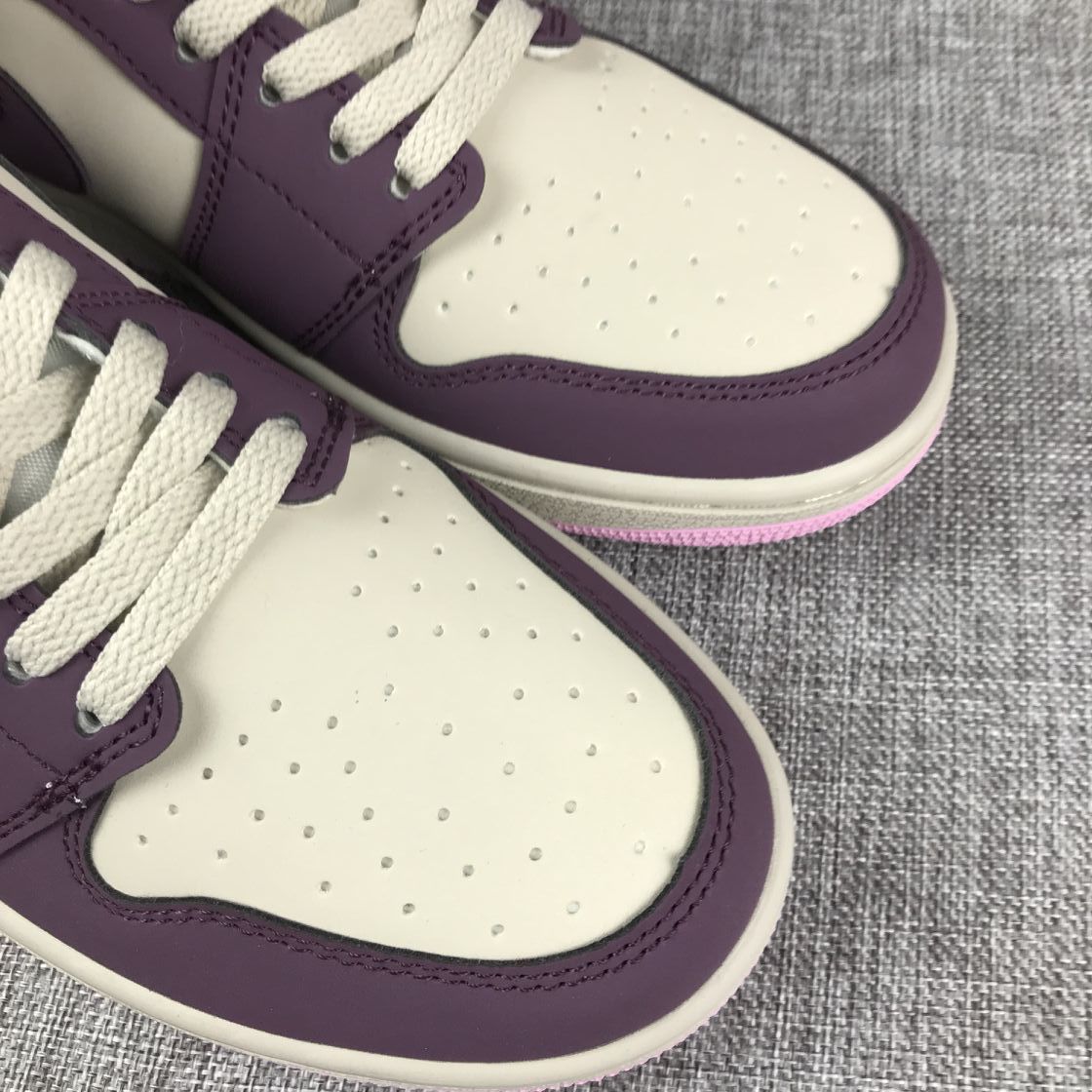 Air Jordan 1 Mid Sneakers in Pink Purple 555112-500 - product image from the listing.