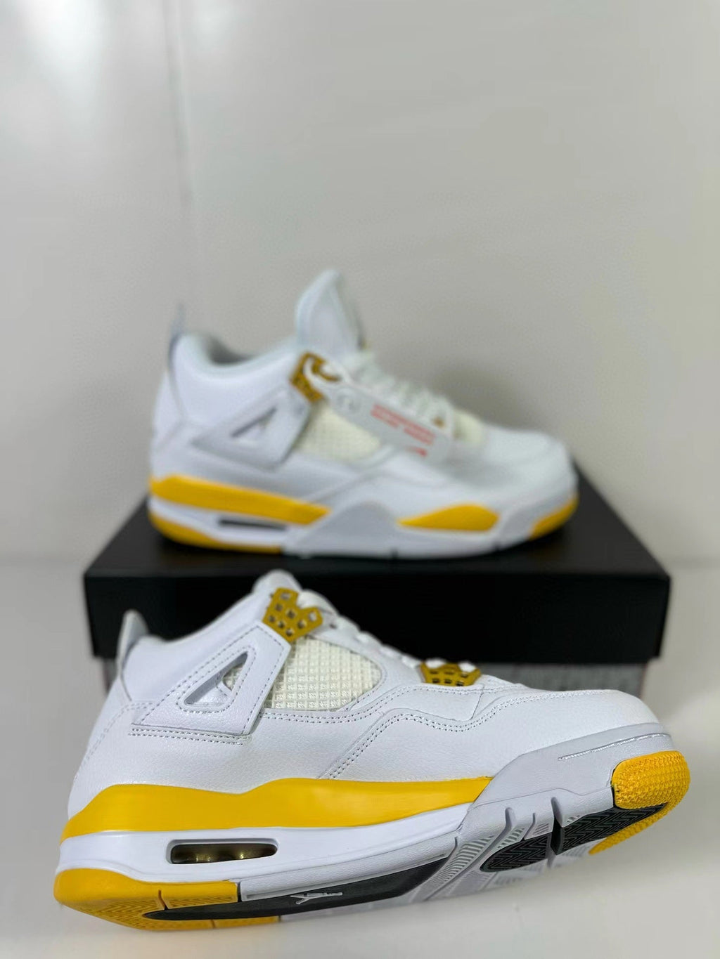 Air Jordan 4 White Yellow Sneakers AQ9129-102 - product image from the listing.