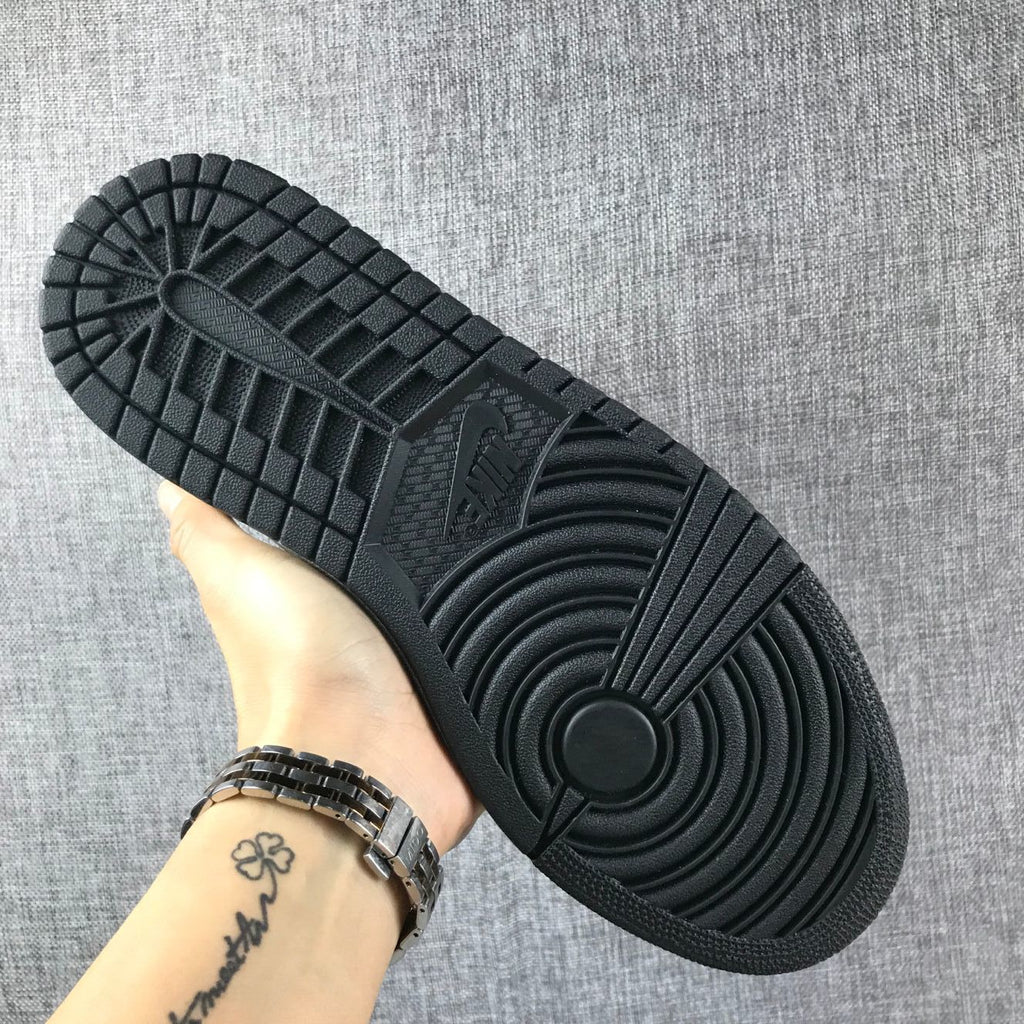 Air Jordan 1 Mid Sneakers in Black Orange 554724-062 - product image from the listing.