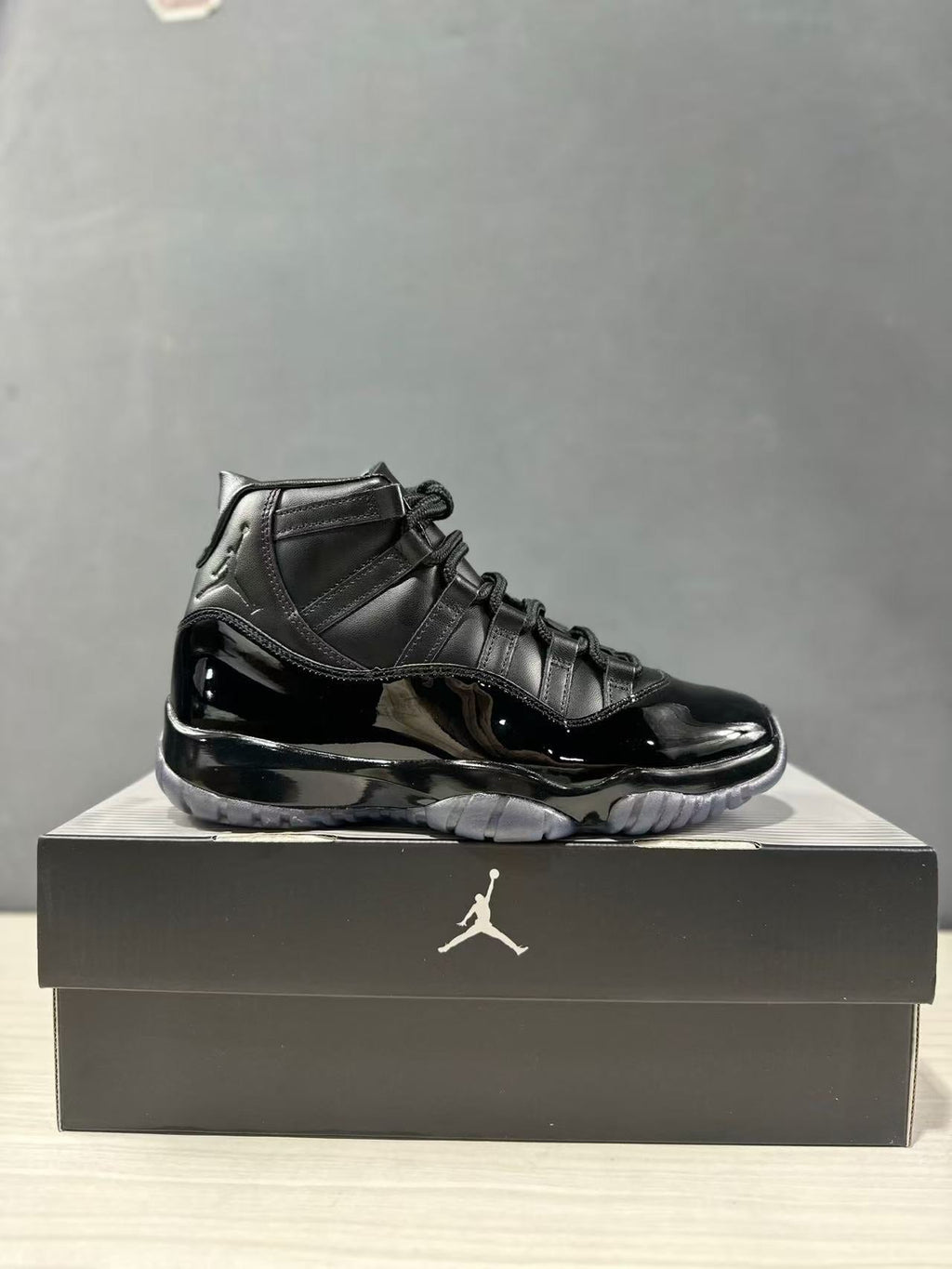 Comme des Garçons × Jordan Air Jordan 11 Sneakers in Black - product image from the listing.
