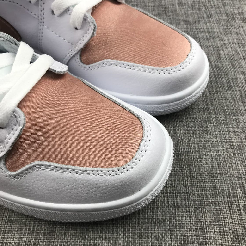 Women's Jordan 1 Mid Rose Gold Silk Sneakers 555112-190 - product image from the listing.