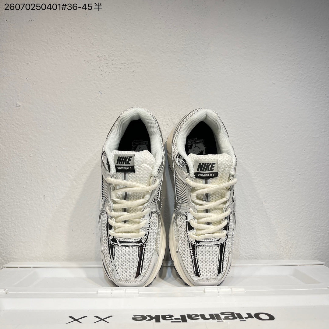 Nike Air Zoom Vomero 5 Sneakers, in White and Black - product image from the listing.