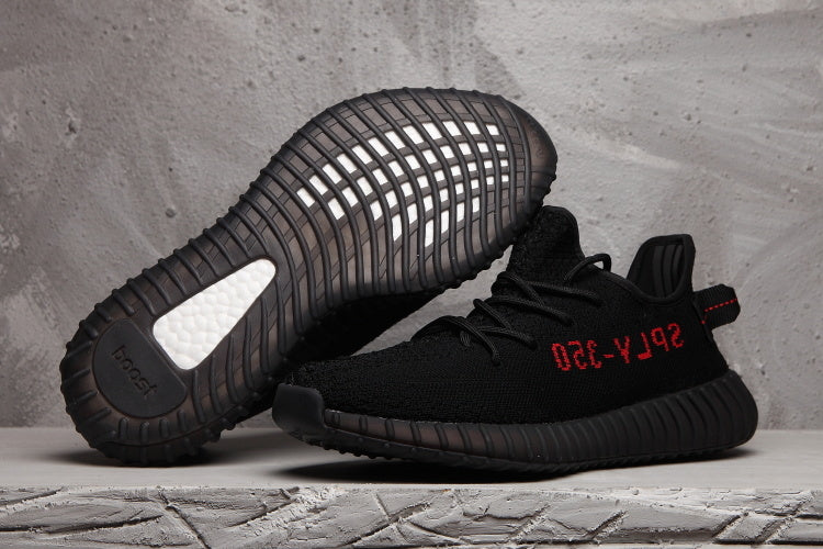 Yeezy Boost 350 V2 Black Knit Trainers with Red Accents - product image from the listing.