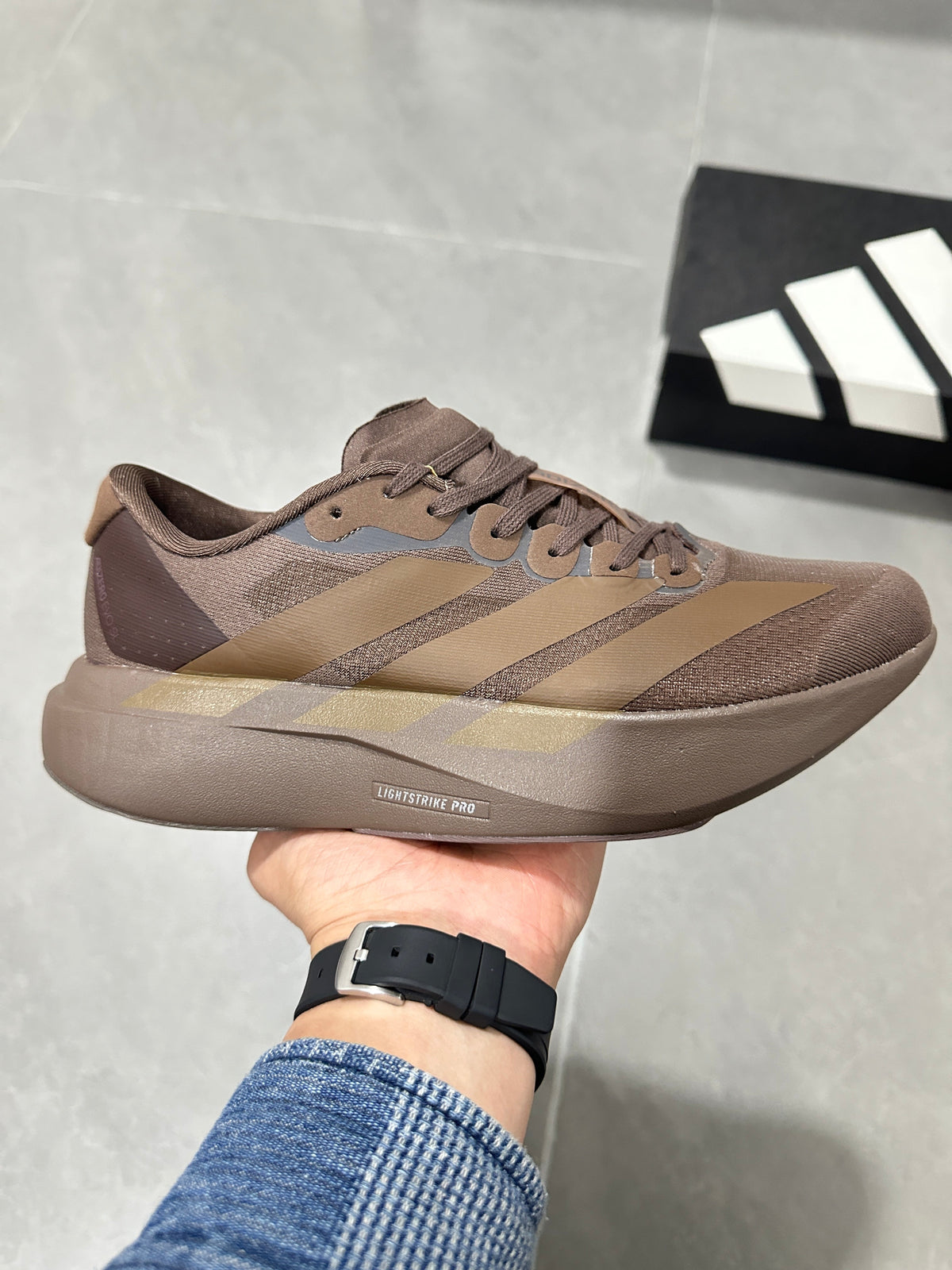 Brown and Tan Adidas Lightstrike Pro Running Shoes - product image from the listing.