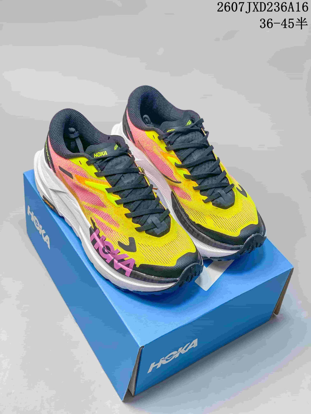 Hoka MAFATE X Trail Running Shoes in Coral and Yellow - product image from the listing.