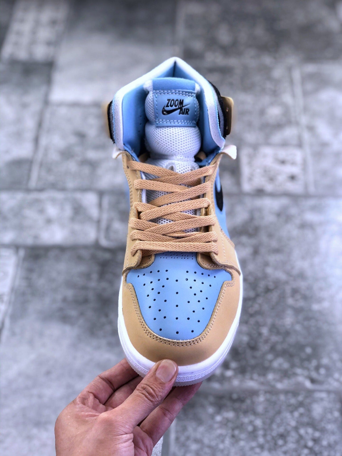 Air Jordan 1 Zoom CMFT Blue Tan Sneakers CT0979-400 - product image from the listing.