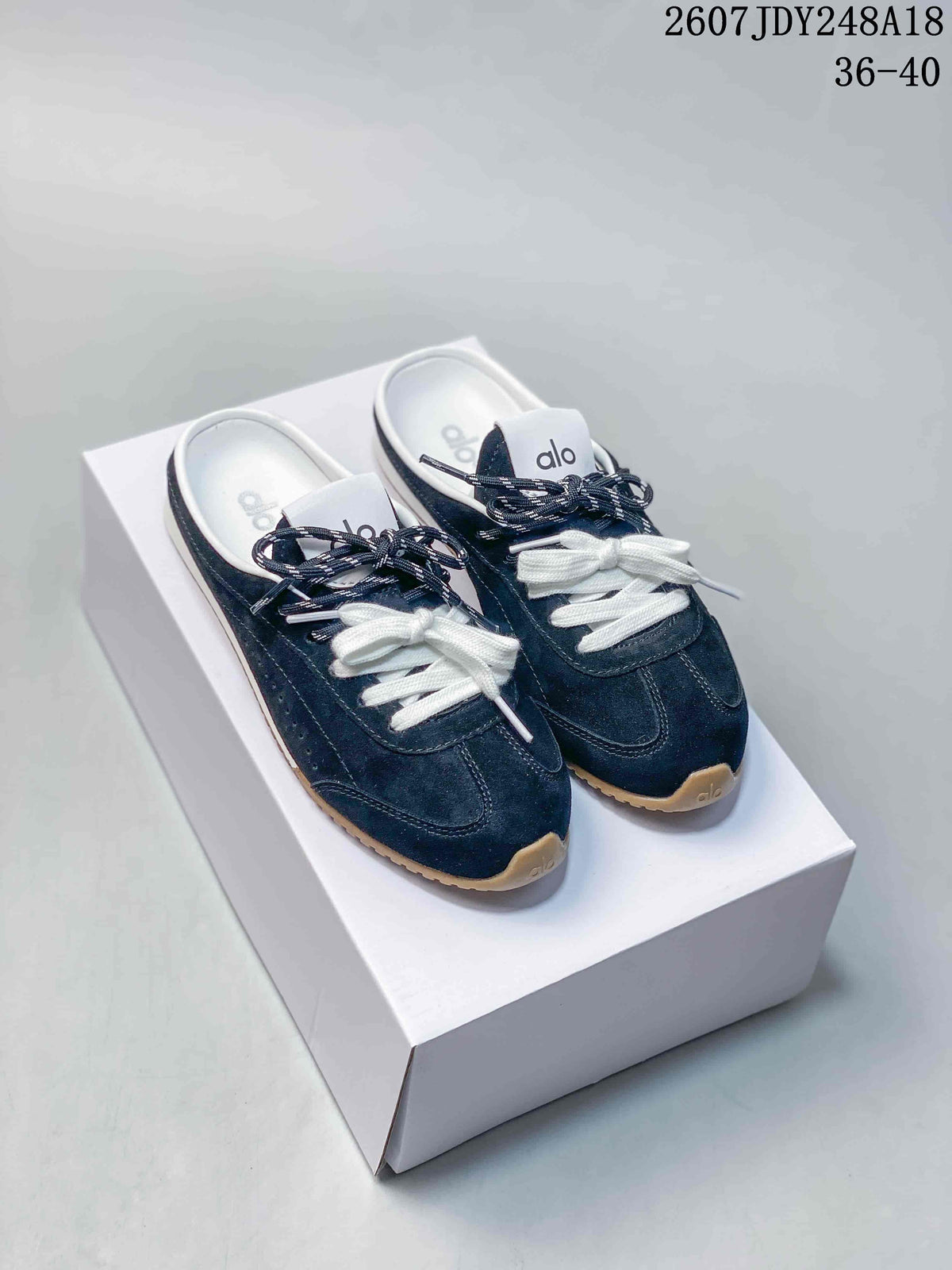 alo Sunset Mule Sneakers in Pink, in Navy and Cream - product image from the listing.