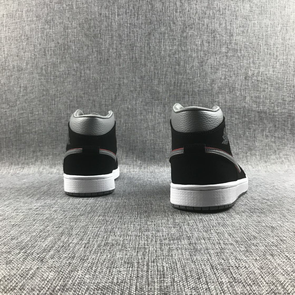 Air Jordan 1 Mid Sneakers in Black Grey Red 554724-060 - product image from the listing.