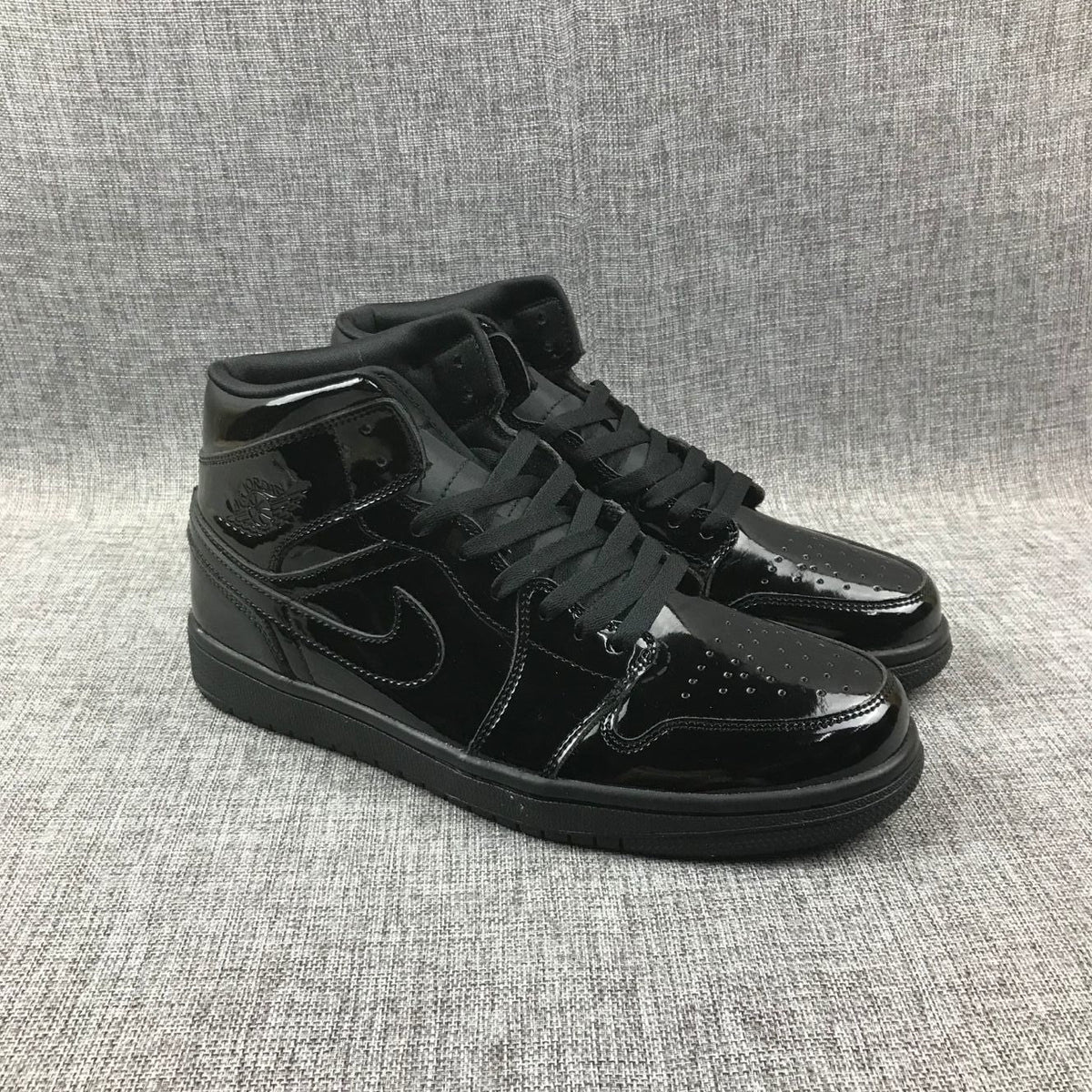 Black Patent Sneakers - Air Jordan 1 Mid BQ6472-002 - product image from the listing.