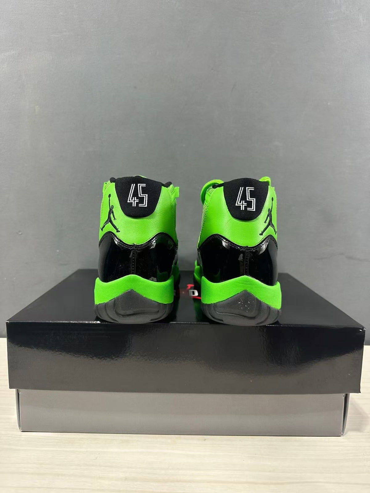 Air Jordan 11 Retro Sneakers in Black Green CT8012-310 - product image from the listing.