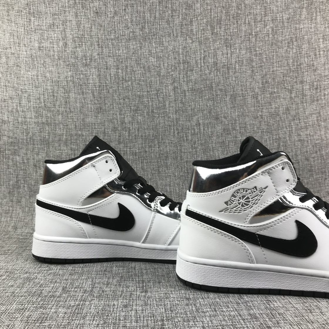 Air Jordan 1 Mid Sneakers in White and Black - product image from the listing.