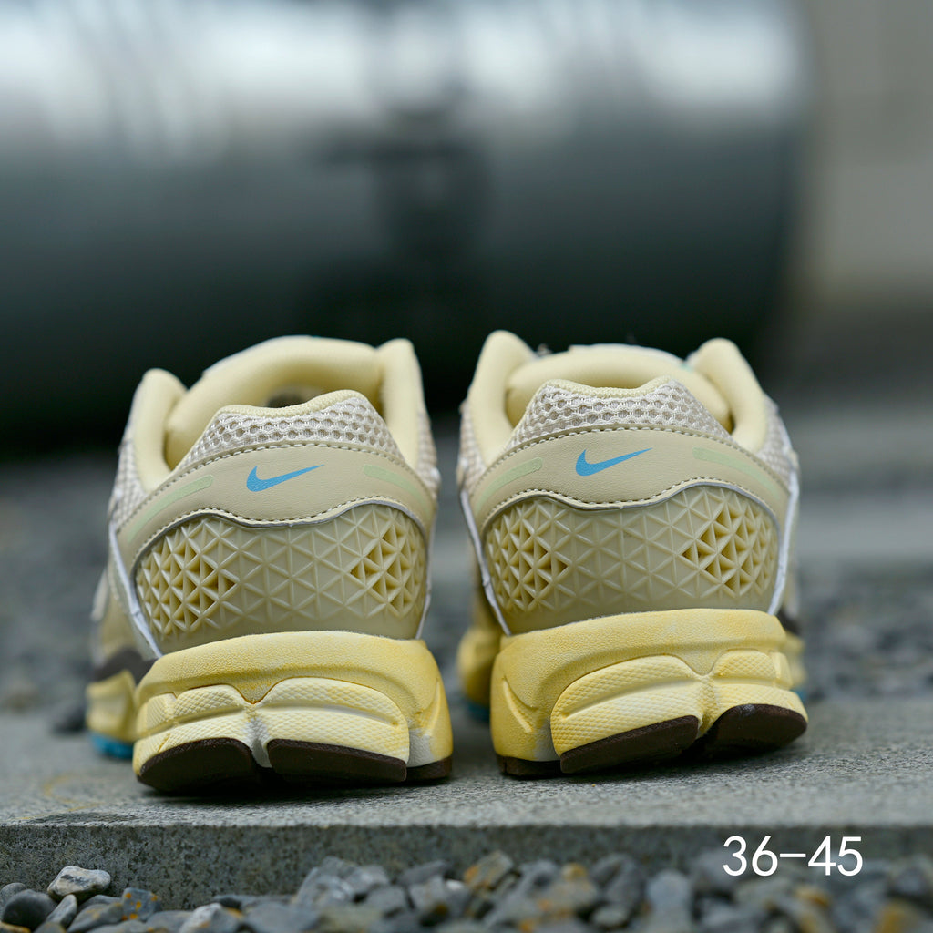 Pale Green and Blue Nike Air Zoom Vomero 5 Sneakers - product image from the listing.