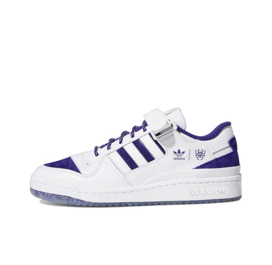 Adidas GY8287 Low-Top Sneakers in White and Purple - product image from the listing.